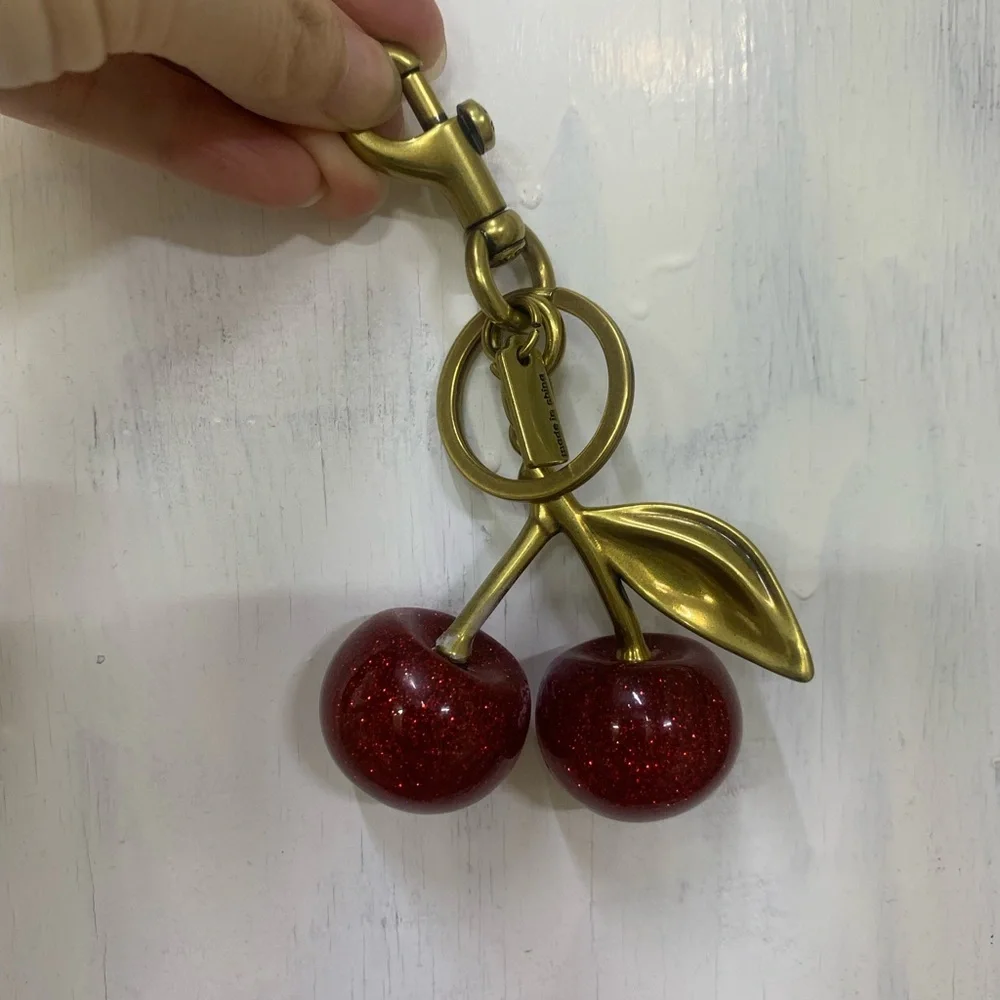 Coach Gold-Tone Glitter Cherry Key Charm in Red